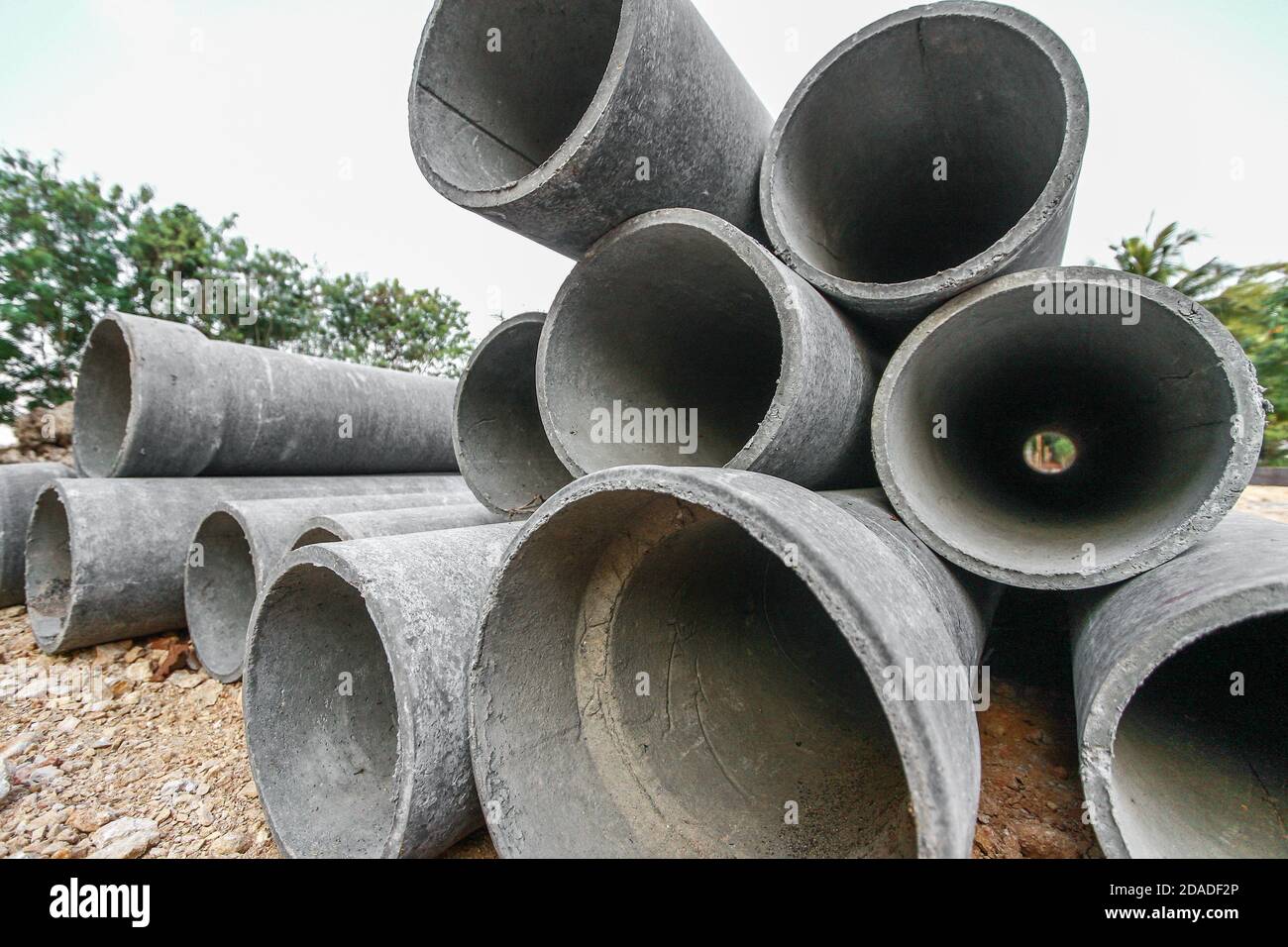 Asbestos pipe pile on the ground in the construction area Stock Photo