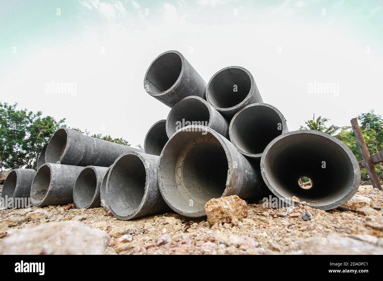 Asbestos pipe pile on the ground in the construction area Stock Photo