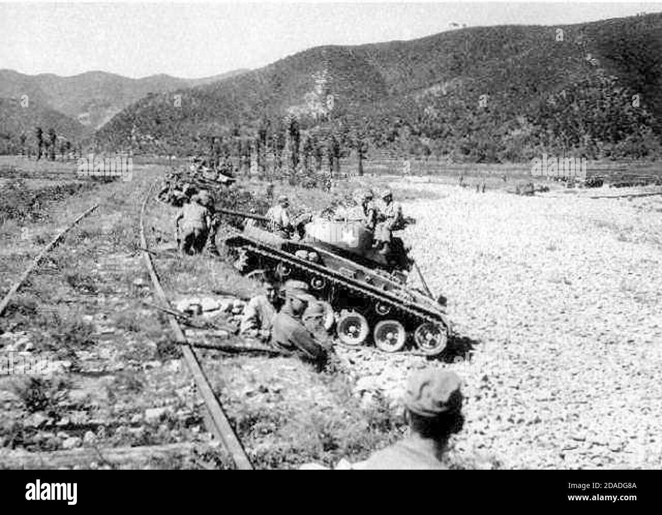 M24 Chaffee light tanks of the US Army's 25th Infantry Division wait for an assault of North Korean T-34-85 tanks at Masan Stock Photo