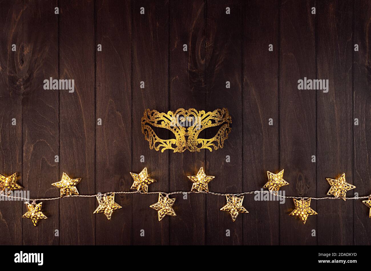 Masquerade decorations on dark wooden background Stock Photo by