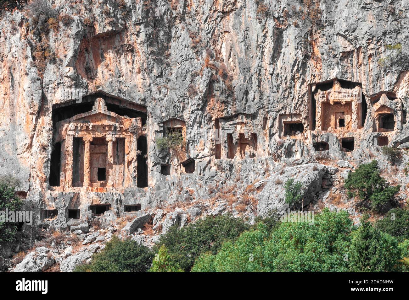 wonder from ancient civilizations : Lycian Rock Tombs of Kaunos near Dalyan, Southern Turkey. Turkish Lycian tombs - ancient necropolis in the mountai Stock Photo