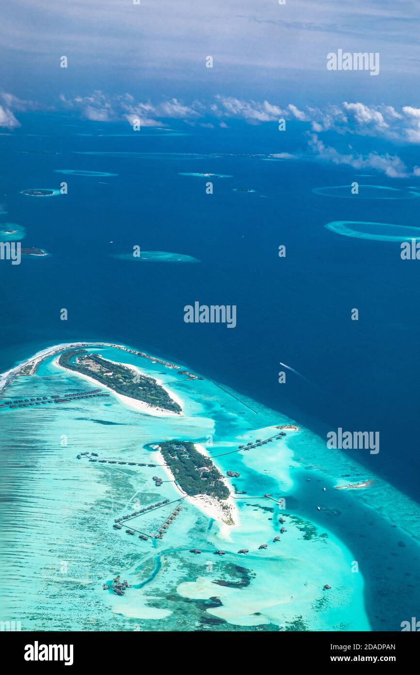 Amazing bird eyes view in Maldives from plane or drone. Luxury resort ...