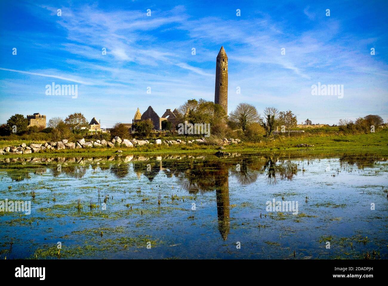 Kilmacduadh Monastery and Round Tower near Gort in south County Galway, Ireland Stock Photo