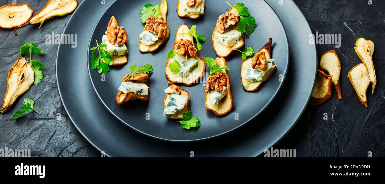 Dry pear,blue cheese and walnut appetizer.Long banner Stock Photo Alamy