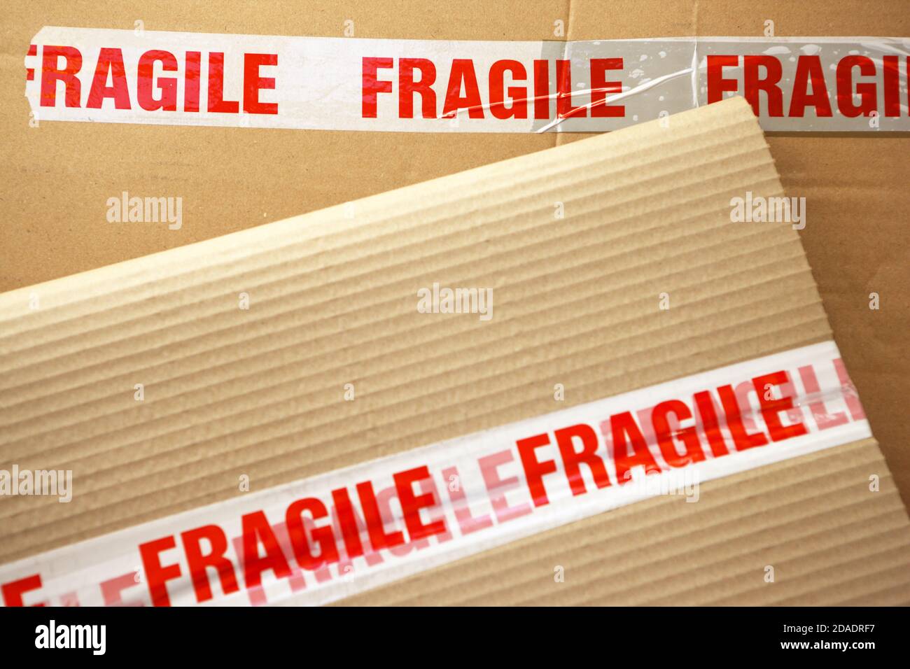 Fragile tape on cardboard packaging Stock Photo