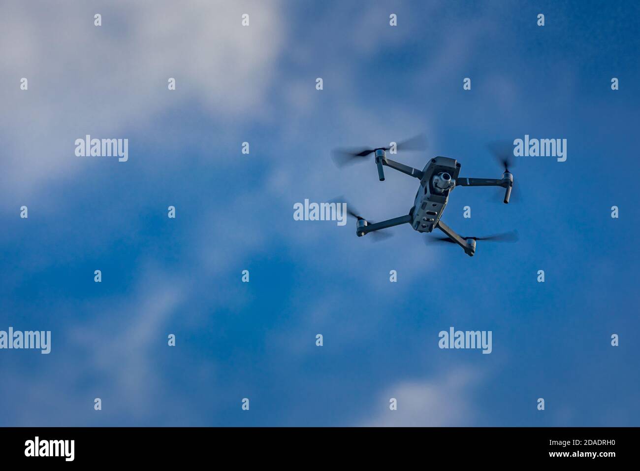 Drone flying drone on a blurry background of nature. Modern technology, surveillance, digital media, content creating, photography and video Stock Photo