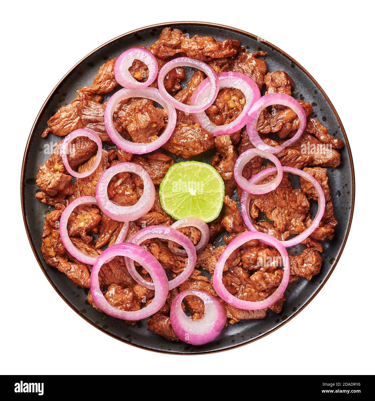 Bistek Tagalog or Bistec Encebollado isolated on white. Filipino spanish cuisine beef steak with onion. Top view Stock Photo