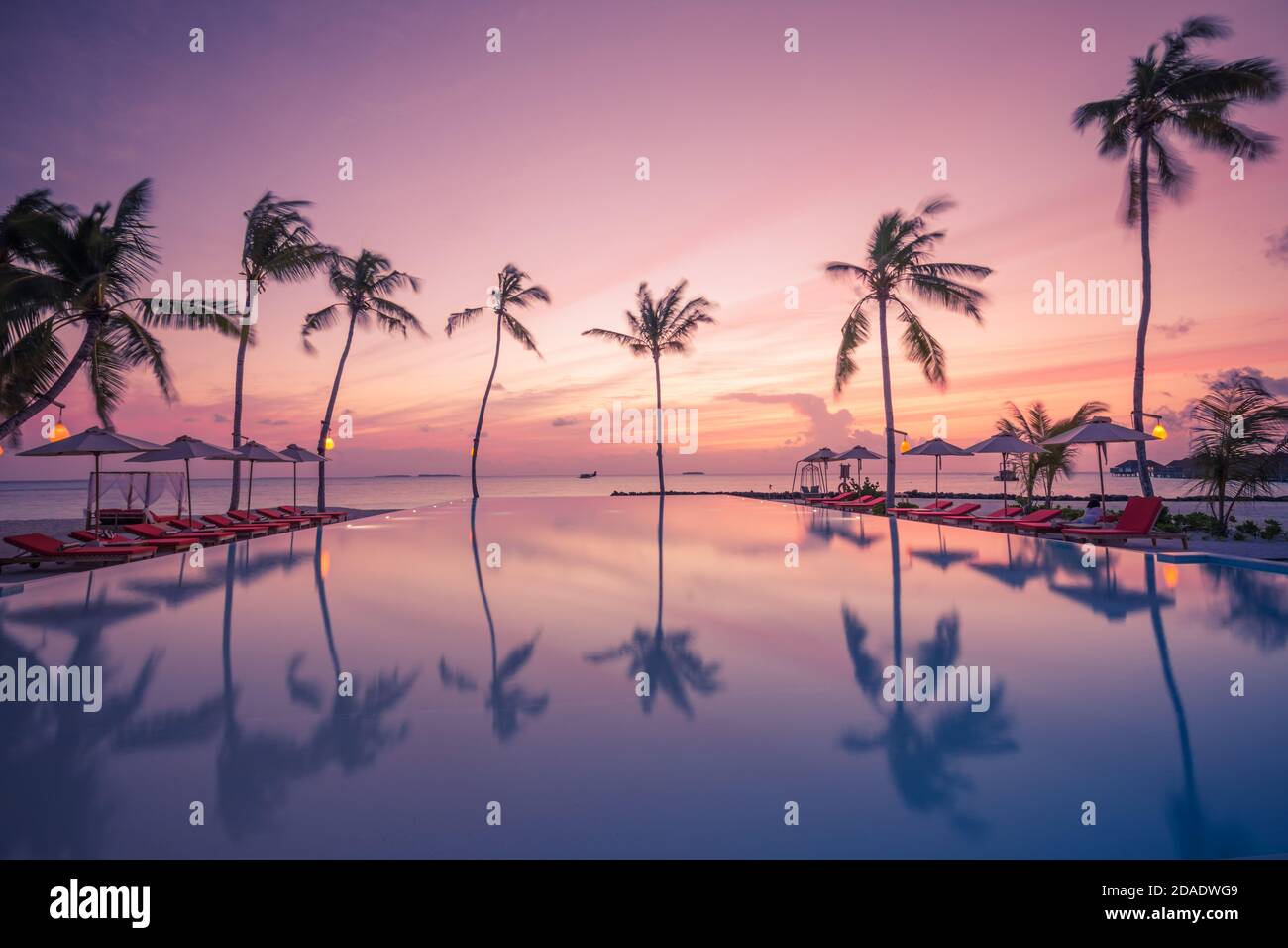 View of Luxury resort beach. Beautiful poolside and sunset sky. Luxurious ...