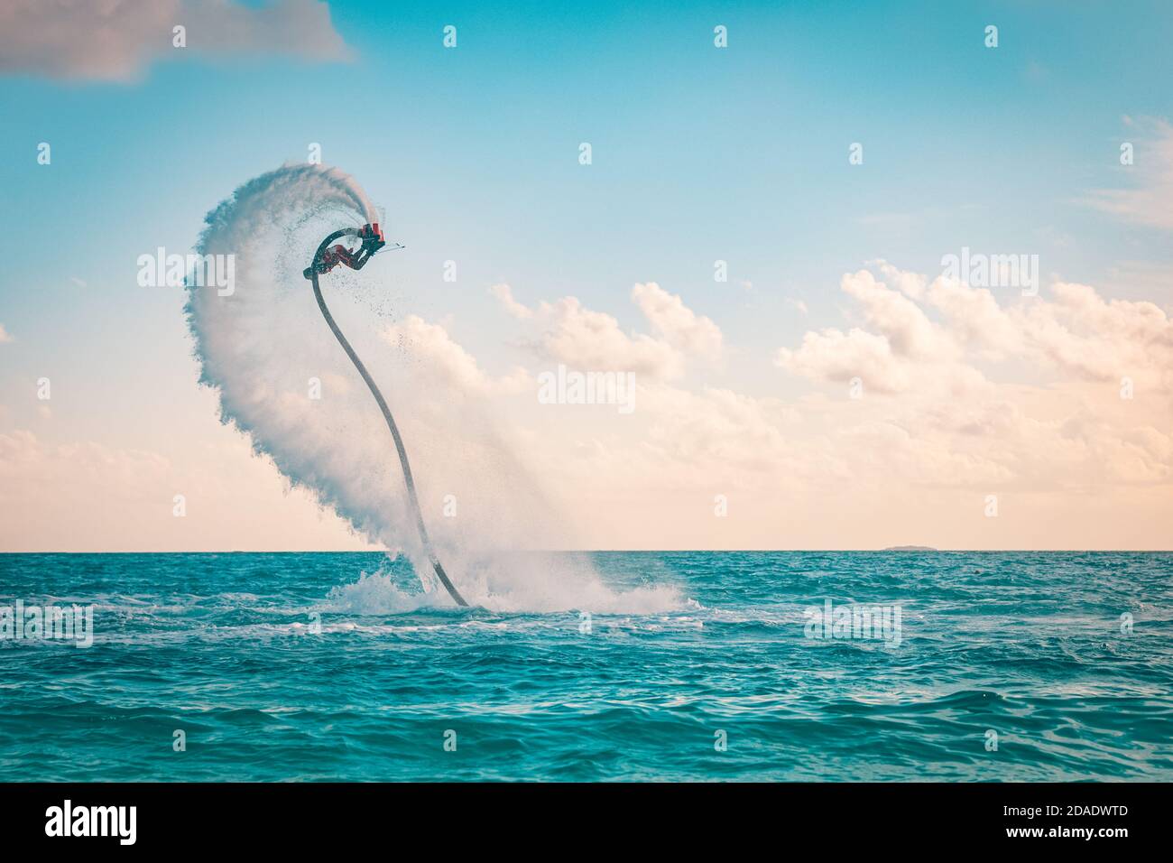 Professional pro fly board rider in tropical sea, water sports concept
