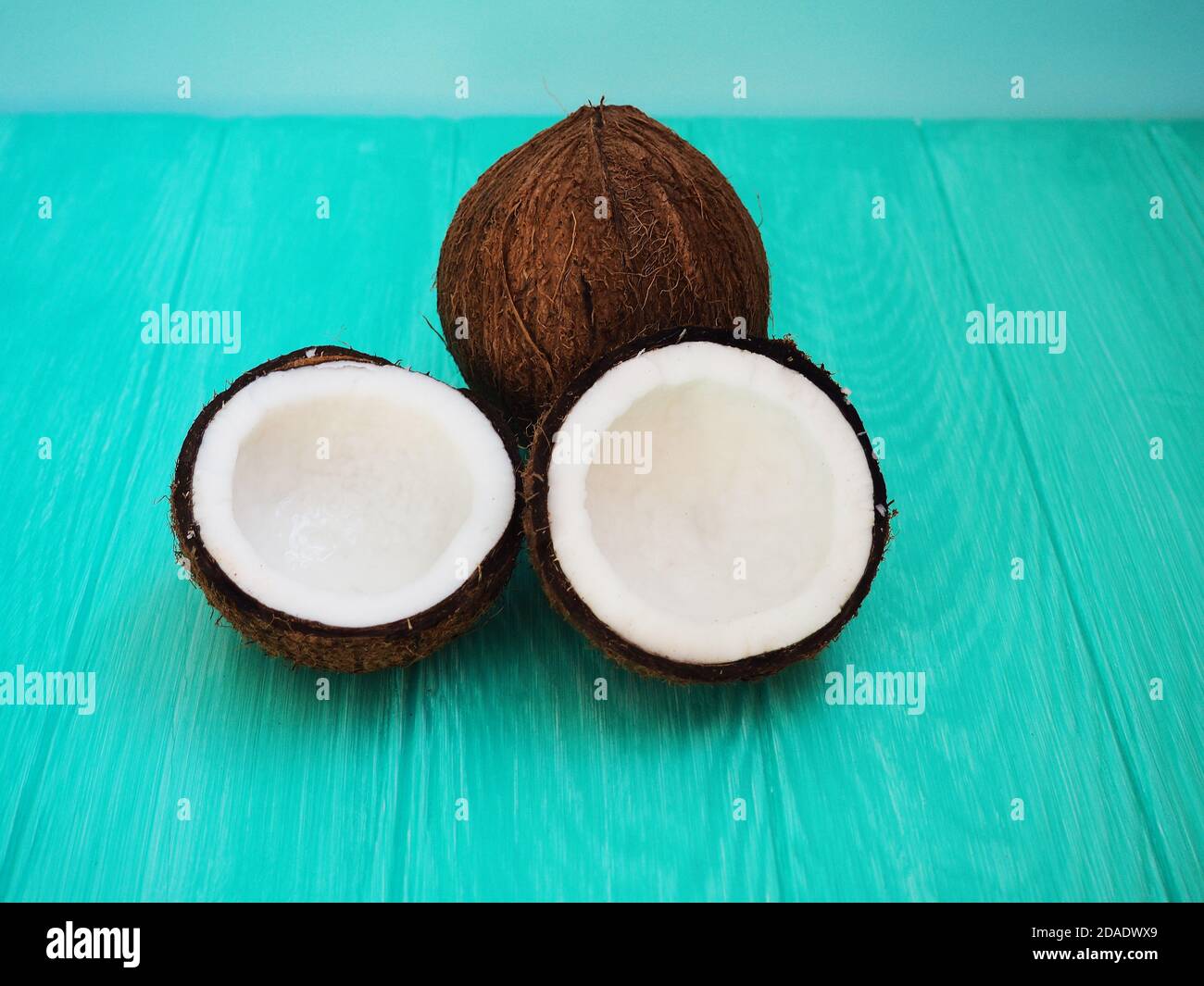 Dish Of Coconut Milk With A Split Fresh Coconut Stock Photo Alamy