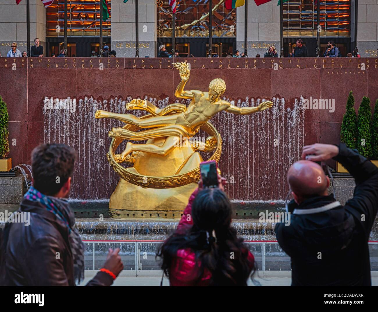 Statue of Prometheus in the lower plaza of the Rockefeller Center, Manhattan, New York, New York State, United States of America. The gilded bronze st Stock Photo