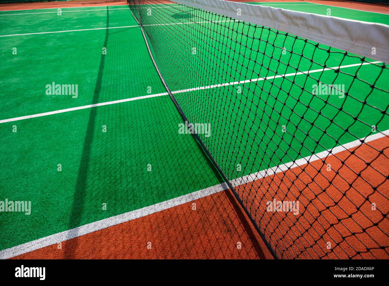 Tennis clay court. Tennis courts making an interesting pattern. Abstract summer outdoor sport, recreational background, tennis court in a sunny day Stock Photo