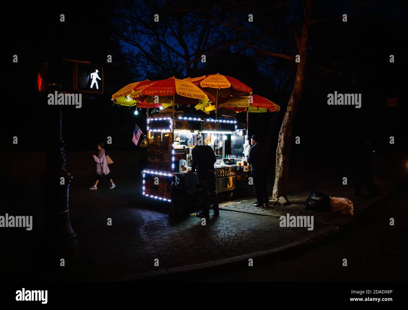 NEW YORK, USA - May 03, 2016: Manhattan street scene. Fast food cart in New York City at night Stock Photo