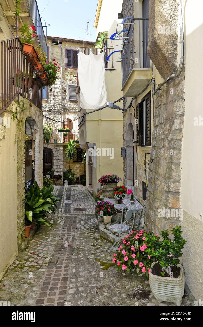 A narrow street among the old houses of Lenola, a medieval village in Latina province, Italy. Stock Photo