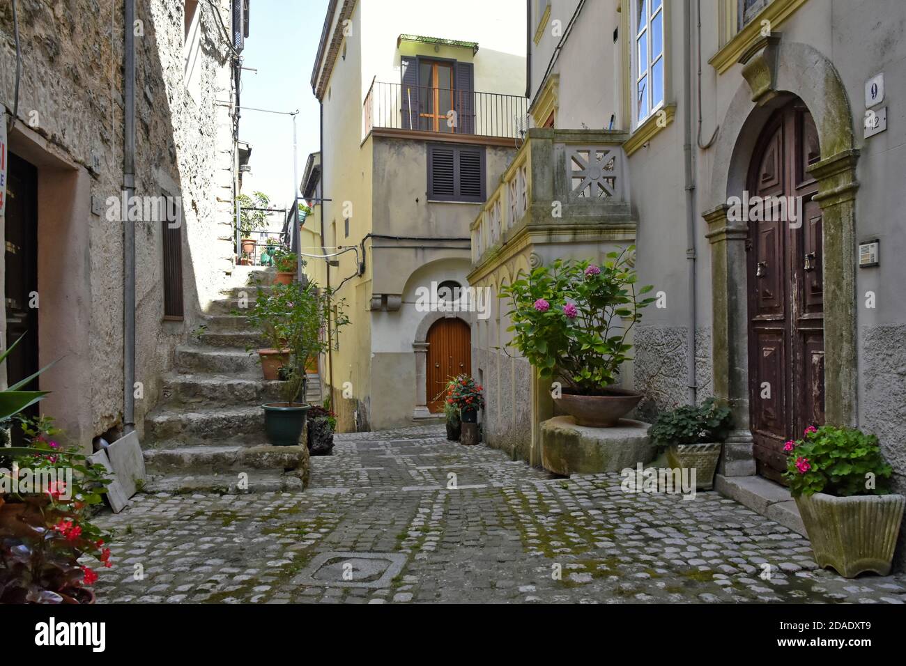 A narrow street among the old houses of Lenola, a medieval village in Latina province, Italy. Stock Photo