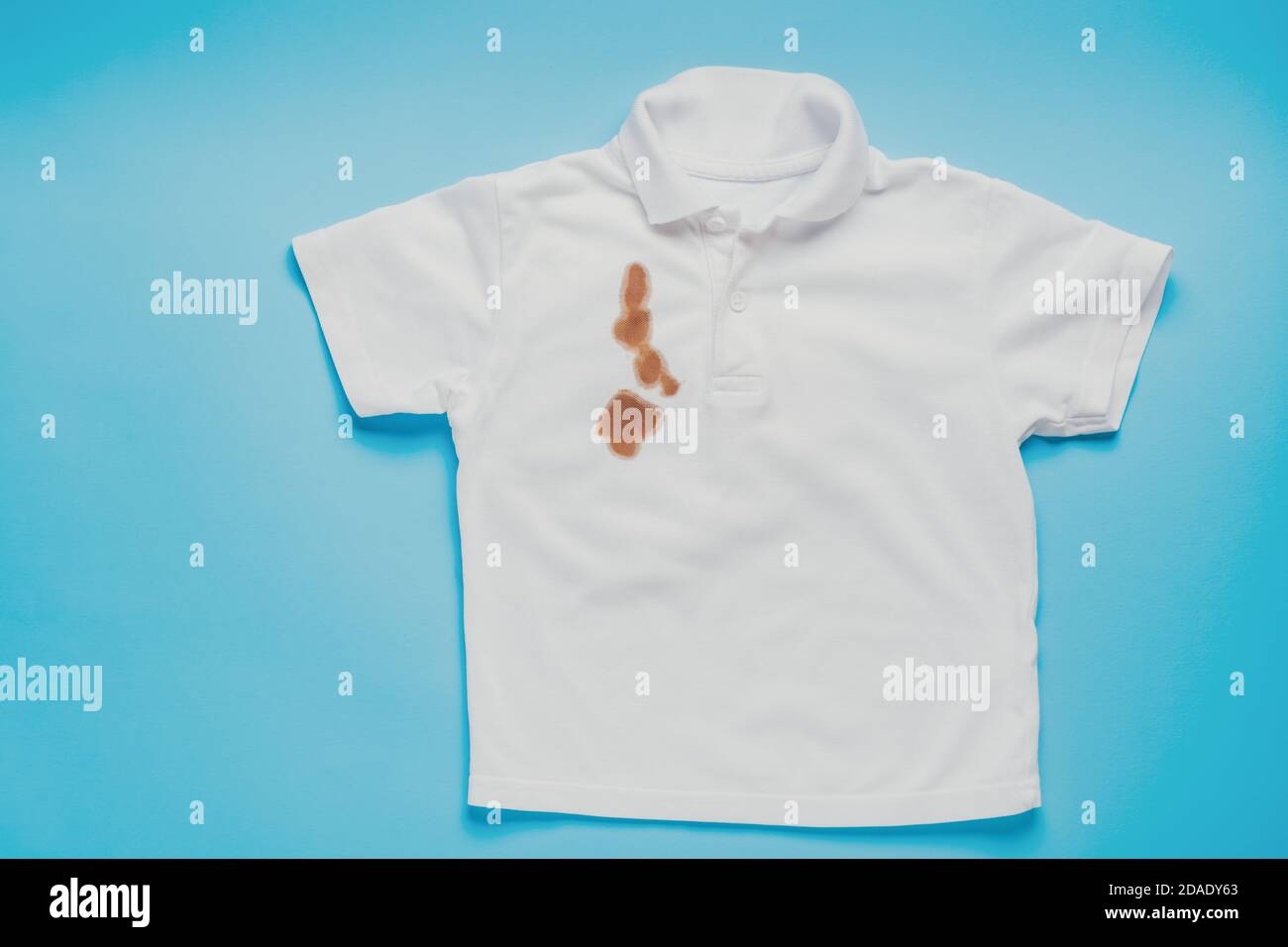 stains from soy sauce on white clothes on a blue background 2DADY63