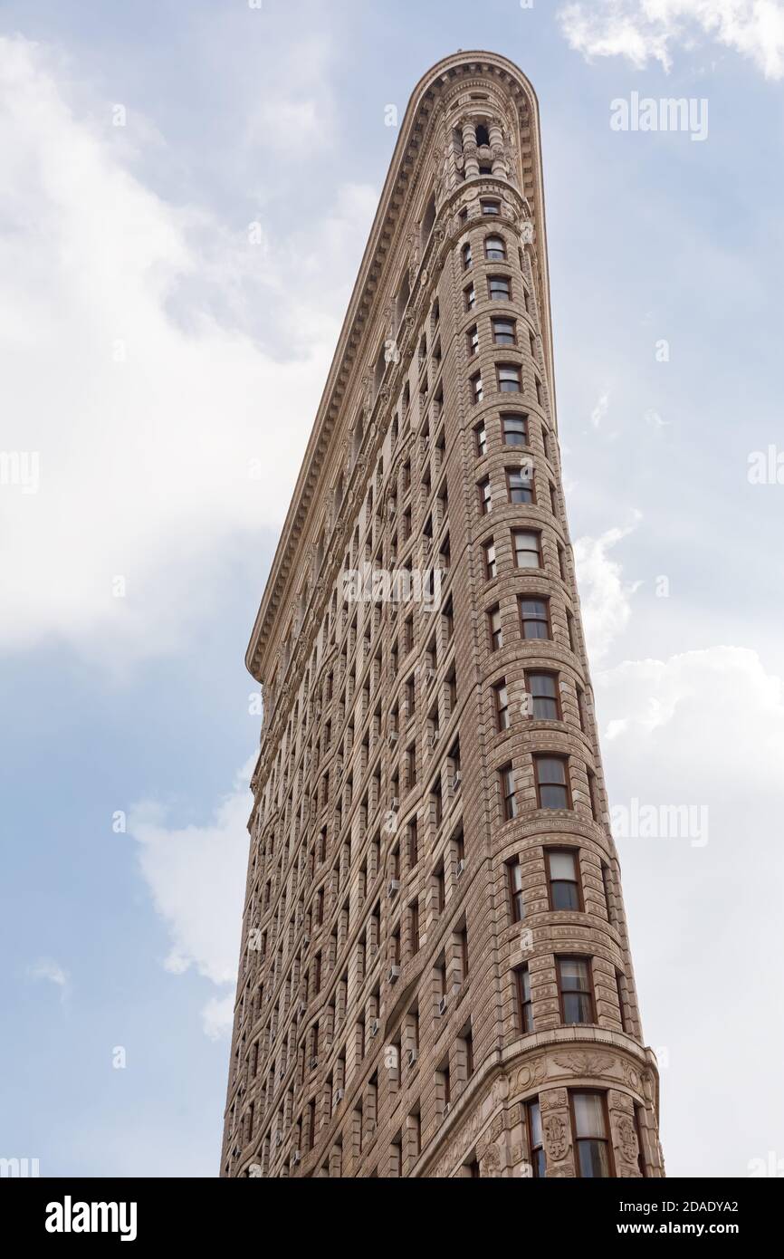 Flatiron Building at NYC. Originally the Fuller Building, is a triangular steel-framed landmarked building located at 175 Fifth Avenue in the borough Stock Photo