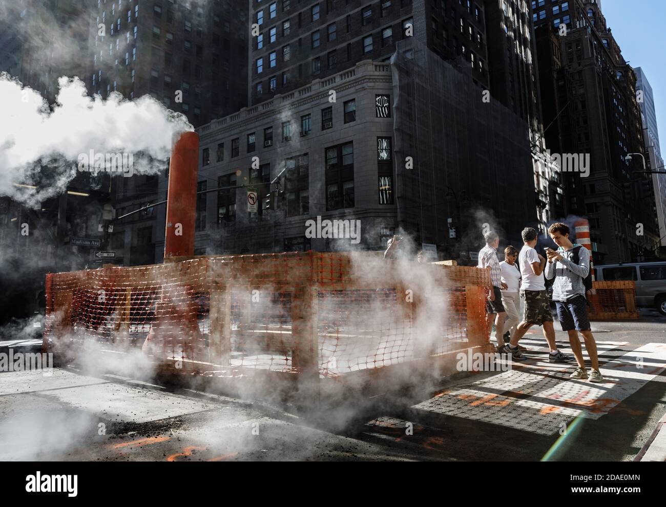 NEW YORK, USA - Sep 23, 2017: Manhattan street scene. Cloud of vapor from the subway on the streets of Manhattan in NYC. Typical view of Manhattan Stock Photo