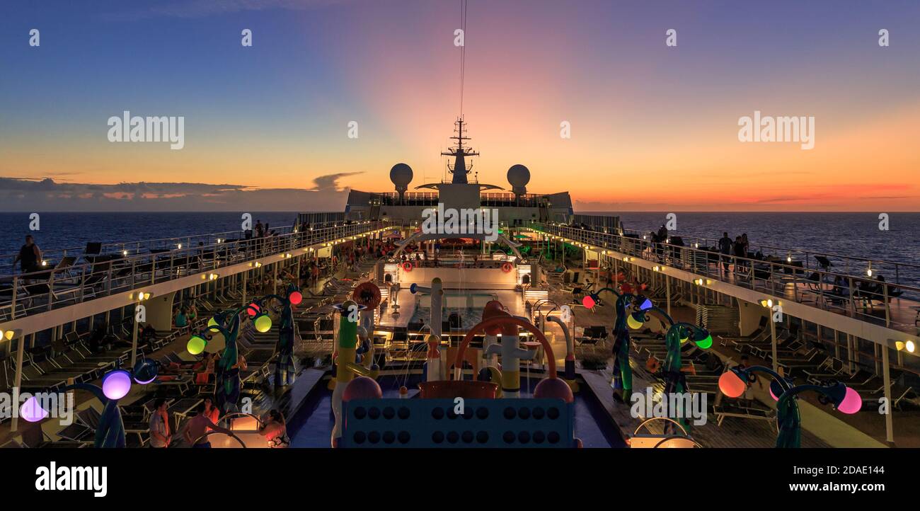 Cruise ship into the sunset Stock Photo