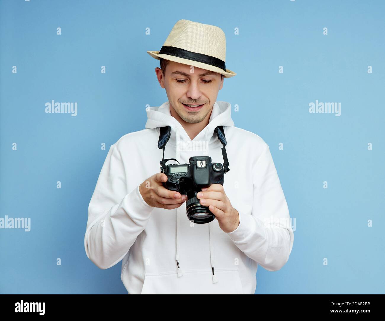 Man photographer with a SLR camera in his hands takes photos Stock ...