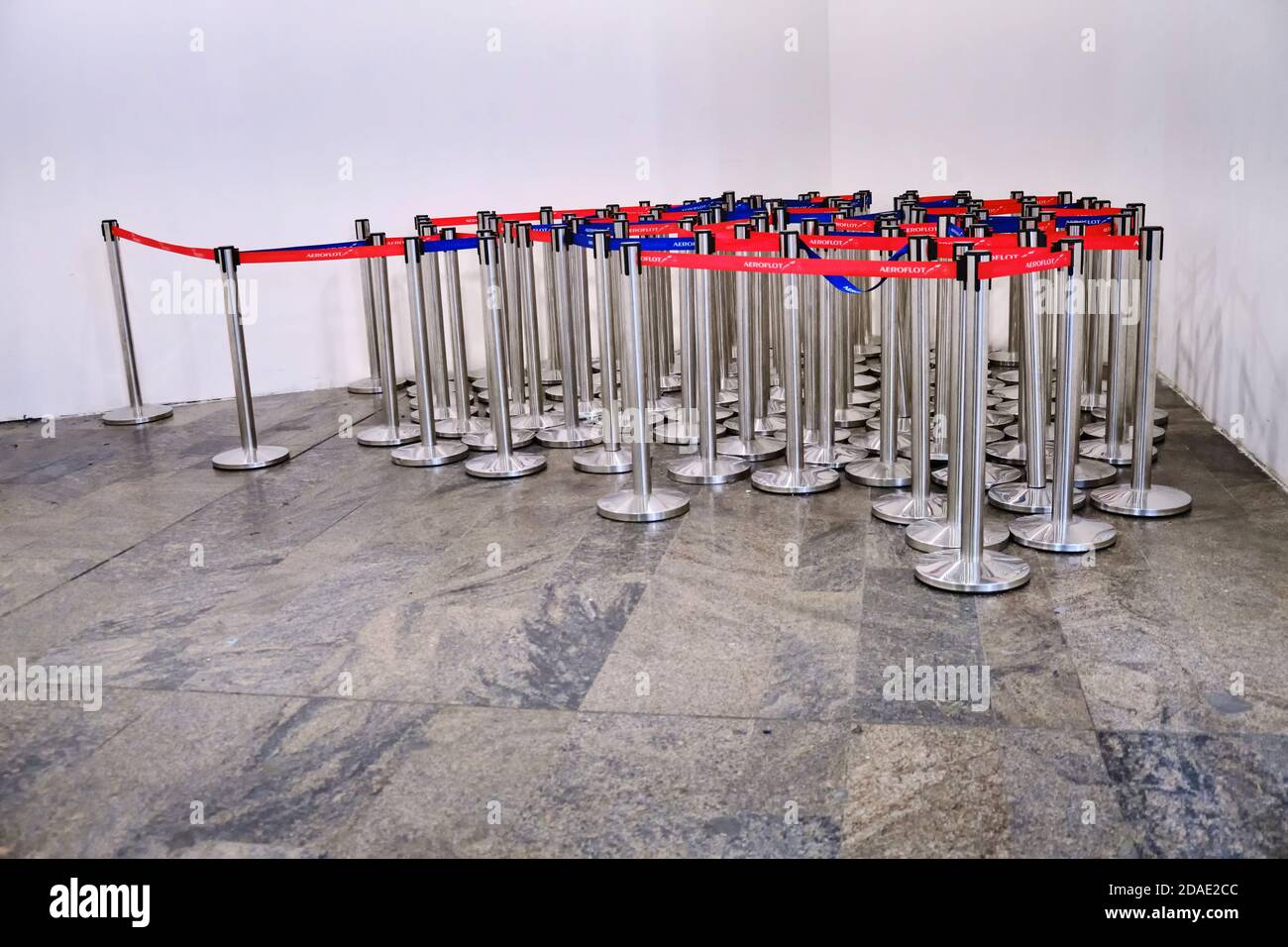 Tape Aeroflot barrier at the airport. Red and blue tape fence barricade entry to stop line of service airport terminal - Sheremetievo, Moscow / Russia Stock Photo