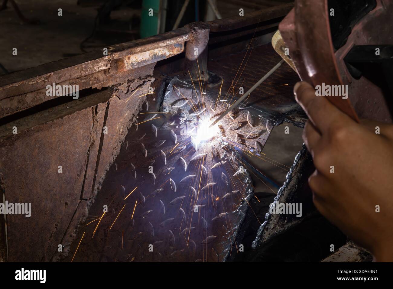 Welding Spark of Car Mudguard from Welder in Car Repair Shop in Zoom