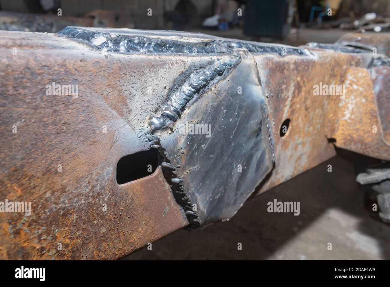 Car Chassis Repairing by Electrode Arc Welding in Car Repair Shop in