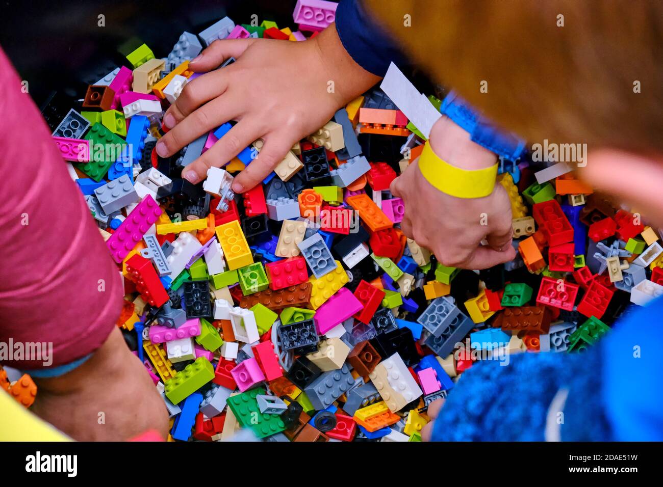 Children collect Lego constructor at a company presentation - Moscow, Russia, 08 02 2019 Stock Photo