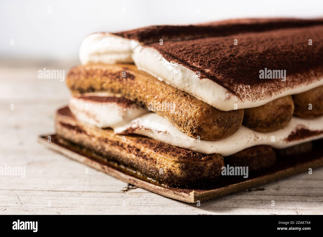 Traditional tiramisu cake on wooden table Stock Photo