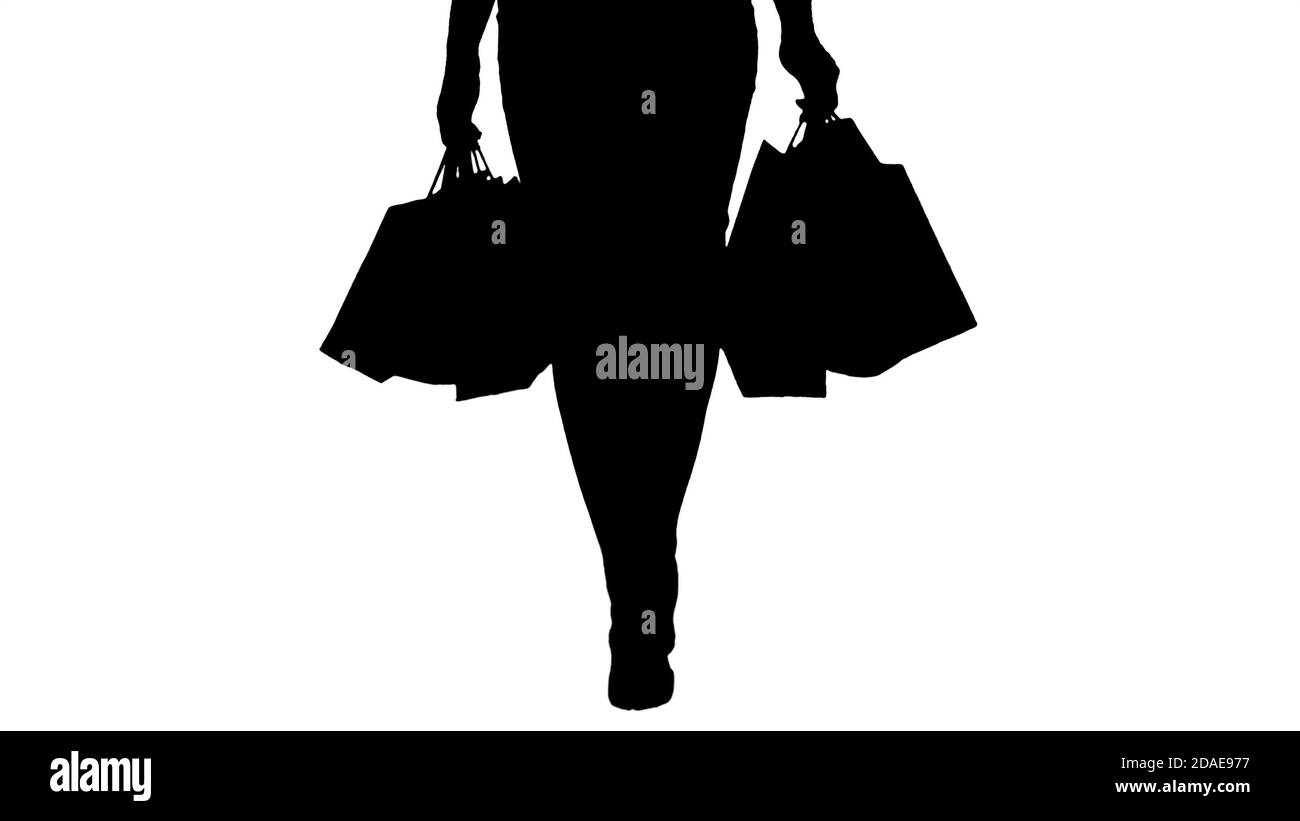 Silhouette Let's go shopping Beautiful woman legs with shopping Stock Photo