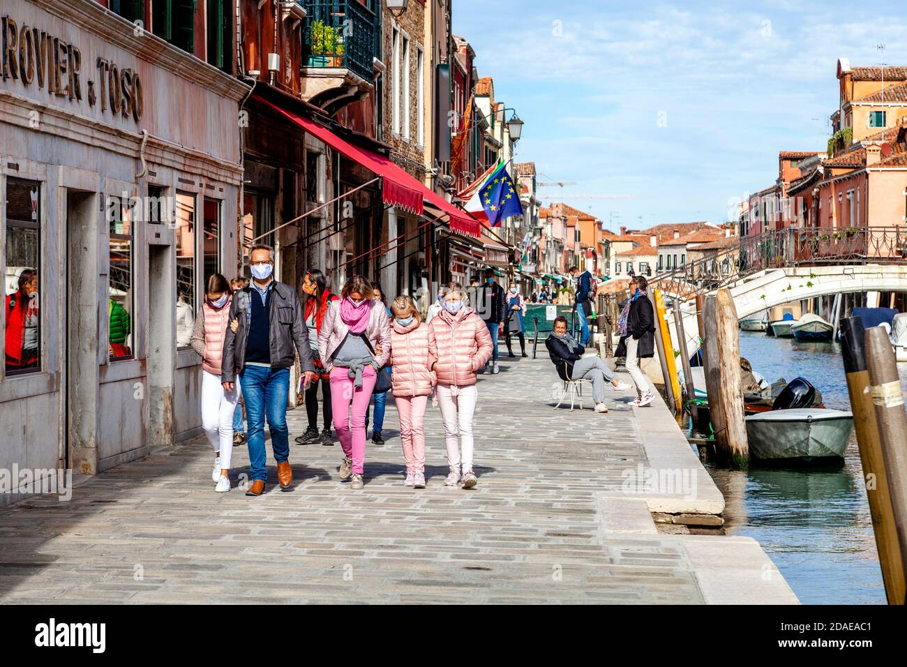 A Family On Vacation In Murano, Venice, Italy. Stock Photo