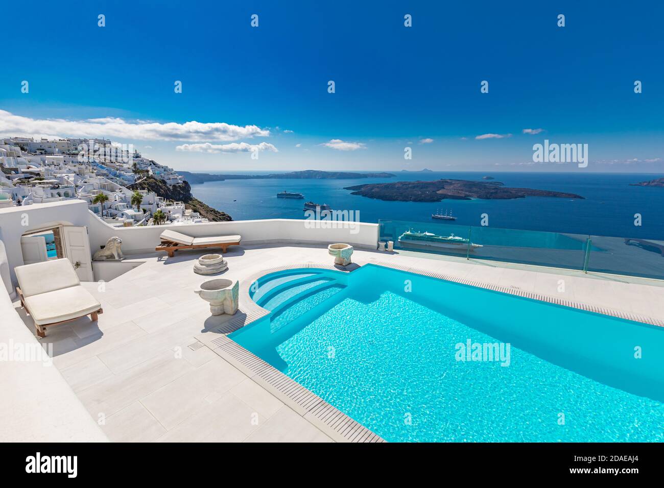 Empty infinity pool Santorini with sea bay view over white architecture. Luxury Europe travel, summer vacation. Amazing vacation landscape, Greece Stock Photo