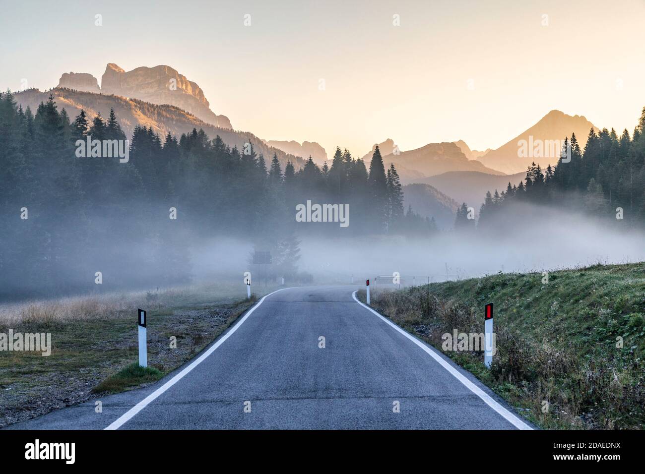 mountain road, morning fog, duran pass, belluno, veneto, italy, europe Stock Photo