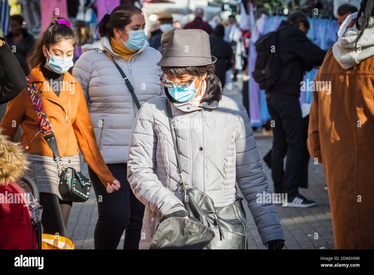 London, UK - 3 November, 2020 - A black woman wearing face masks while shopping at Walthamstow market Stock Photo
