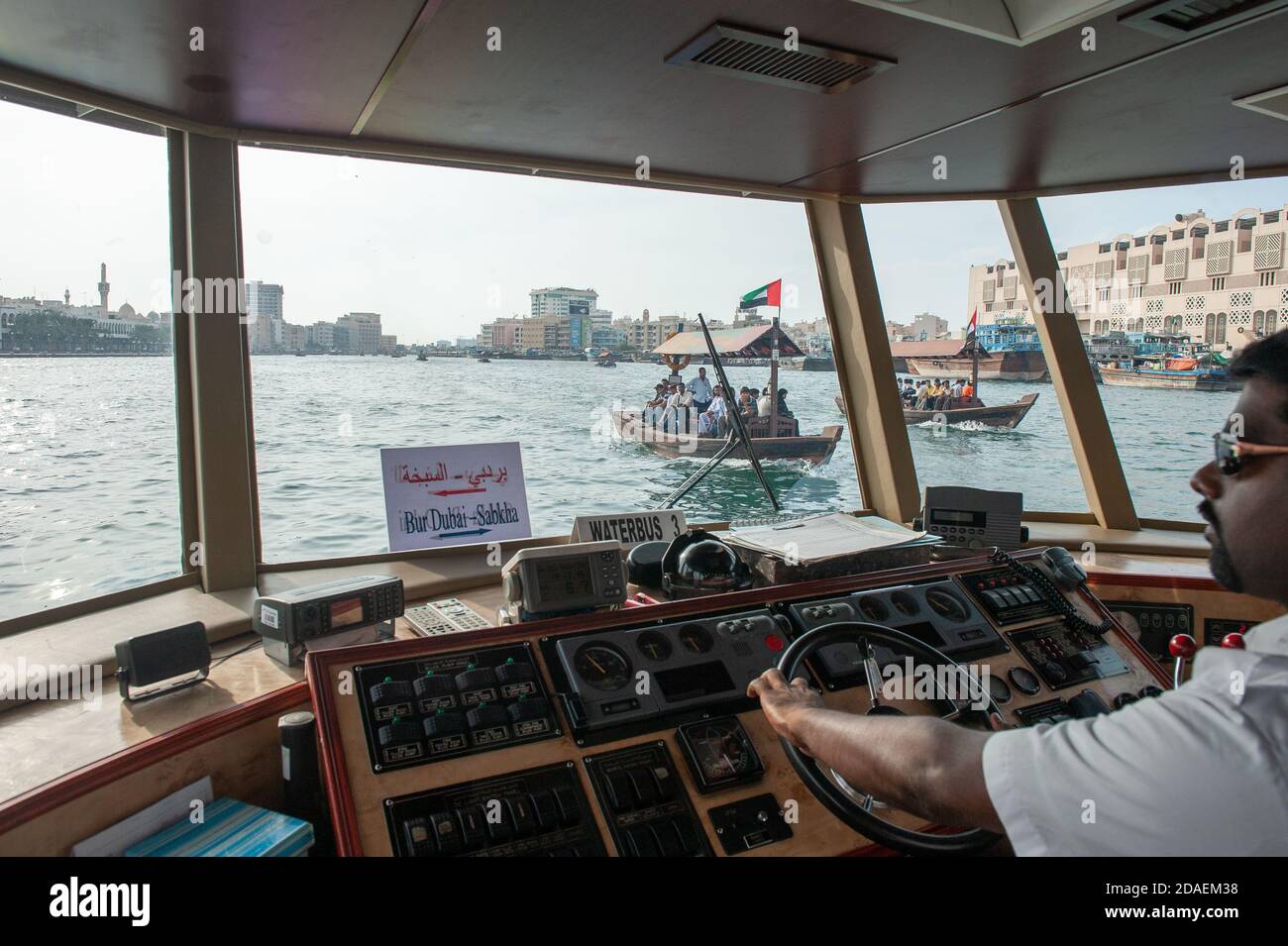 A view from the cabin of a water taxi on Dubai Creek, Dubai. Stock Photo