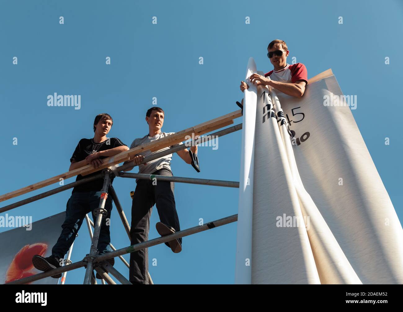 KYIV, UKRAINE - May 04, 2017: Worker prepares billboard to installing new advertisement on the Independence Square in Kyiv Stock Photo