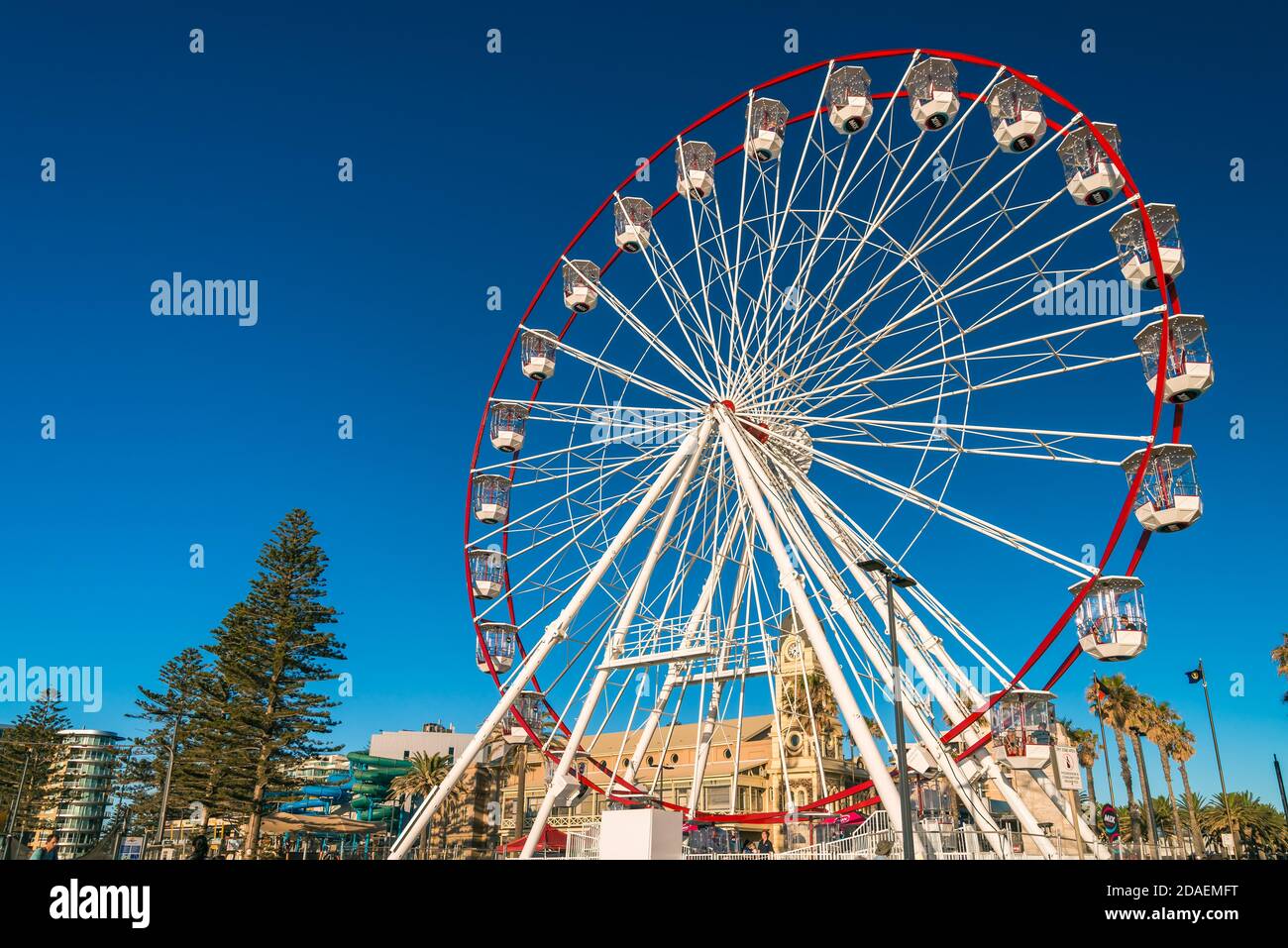 Adelaide, South Australia - January 12, 2019: Glenelg Mix102.3 Giant Ferris Wheel viewed from the Moseley Square on a bright summer day Stock Photo