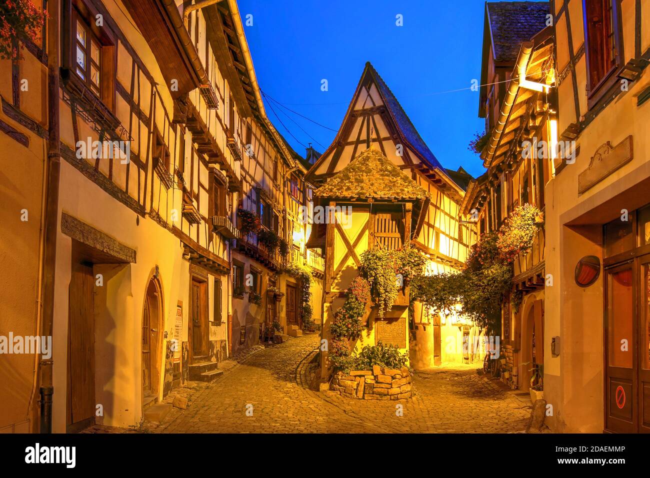 Night scene along the Rue de Remparts circling the center of Eguisheim, a wonderfully preserved medieval  village in the Alsace wine region of France. Stock Photo