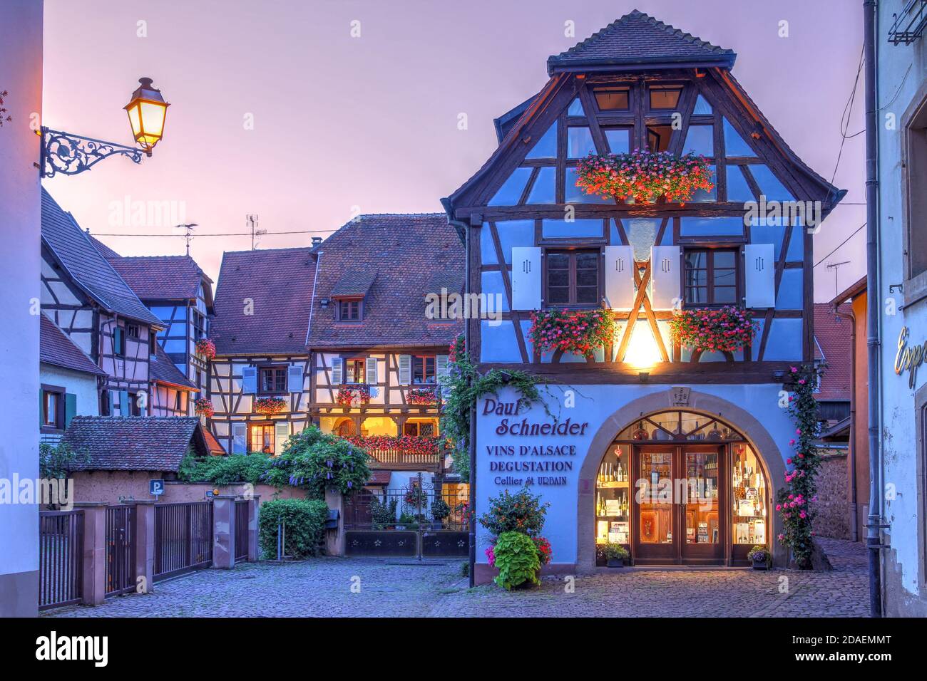 Eguisheim, France - August 10, 2020 - Night scene on the charming streets of Eguisheim, a typical village in the Alsace wine region of France, featuri Stock Photo