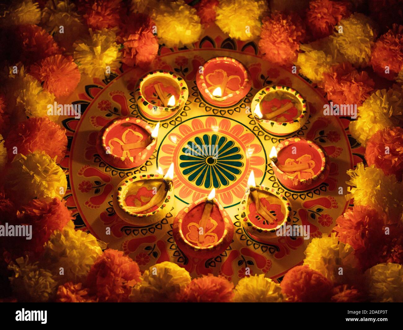 Clay Diya or lamp with rangoli stock image Stock Photo - Alamy