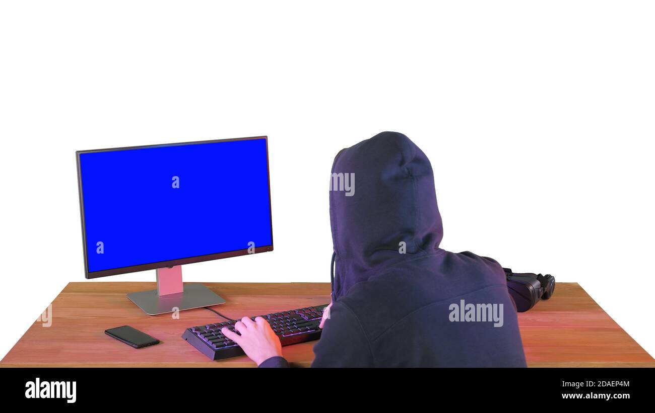 Hacker in hood cracking code using pc on white background. Stock Photo