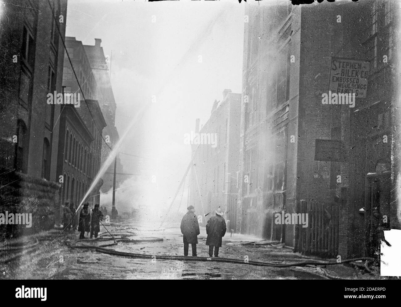 Firefighters spraying water at the Iroquois Theater building during the fire, Chicago, Illinois, December 30, 1903. Stock Photo