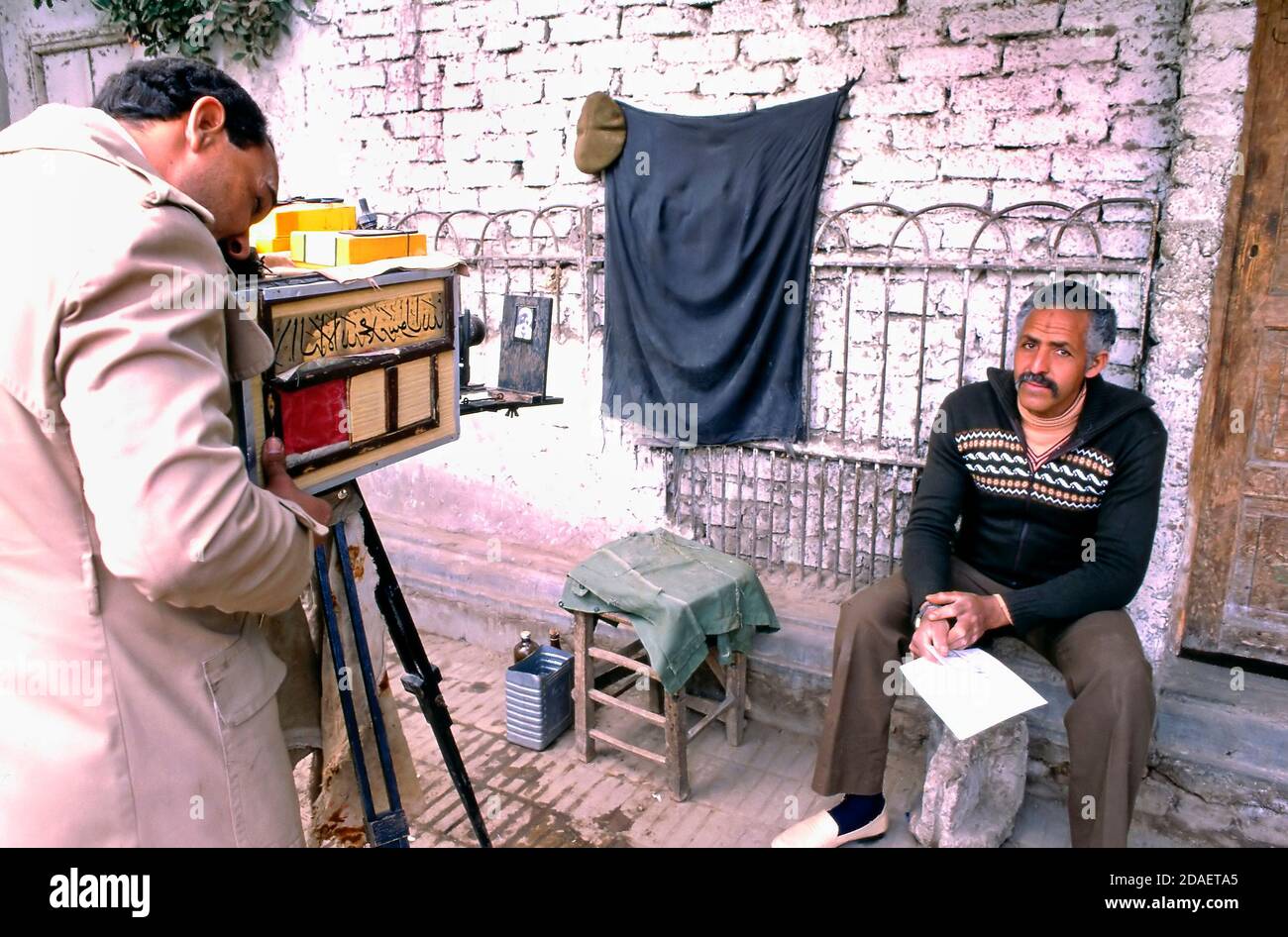 CAIRO, EGYPTJULY 07, 2018 A street photographer with an old fashioned