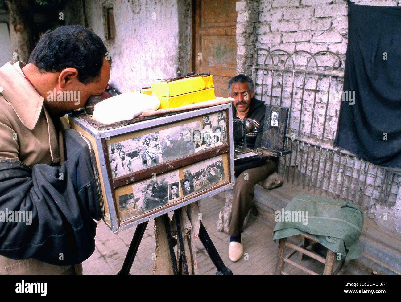 CAIRO, EGYPTJULY 07, 2018 A street photographer with an old fashioned