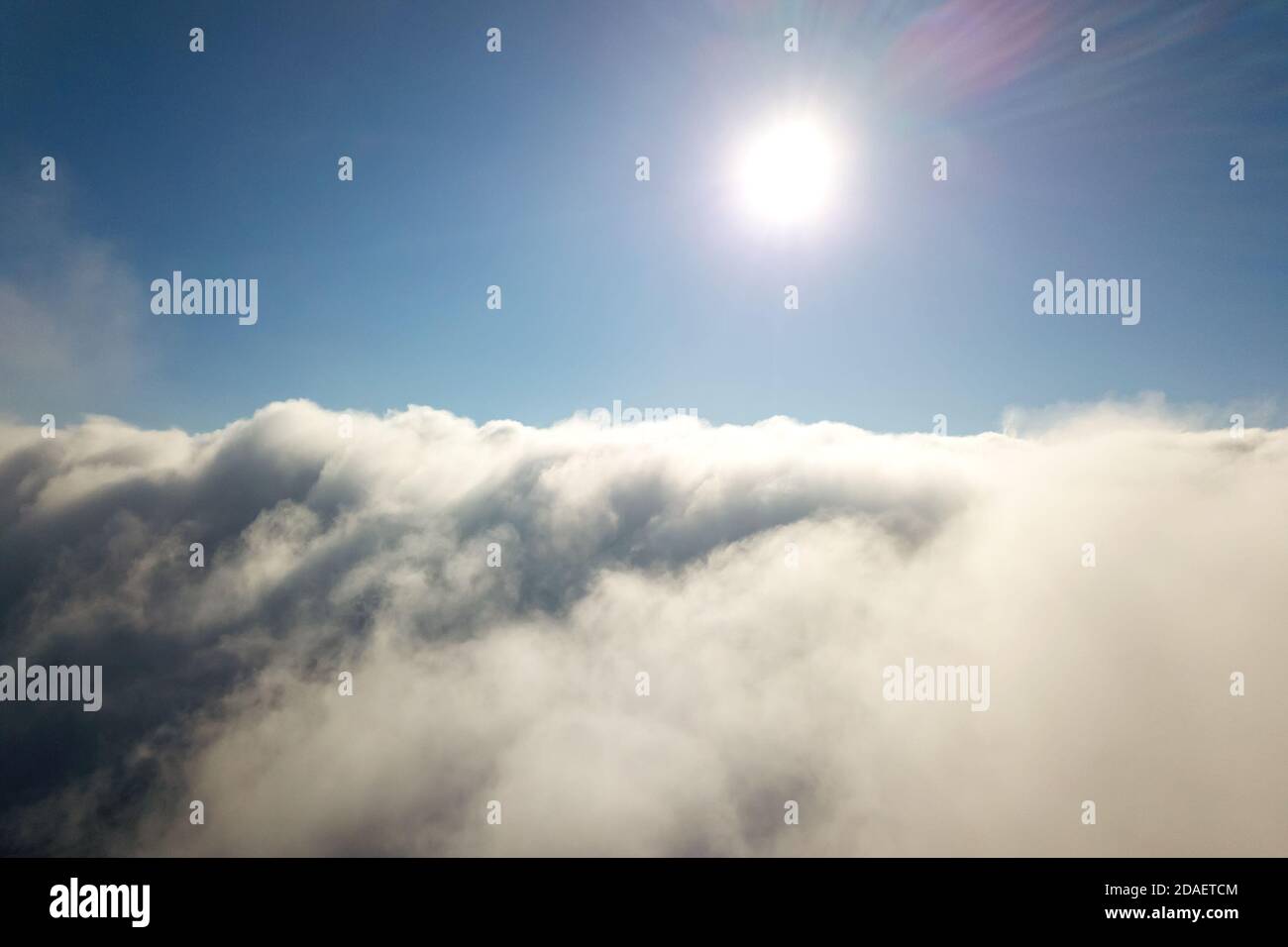 Aerial view from above of white puffy clouds Stock Photo - Alamy