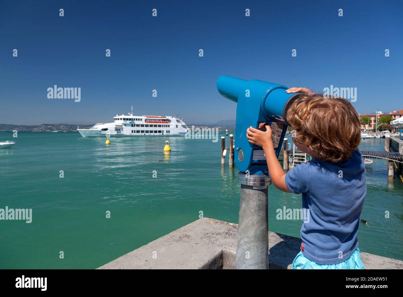 geography / travel, Italy, Lombardy, Sirmione, Lake Garda, boy on the spyglass in Sirmione on the sout, Additional-Rights-Clearance-Info-Not-Available Stock Photo