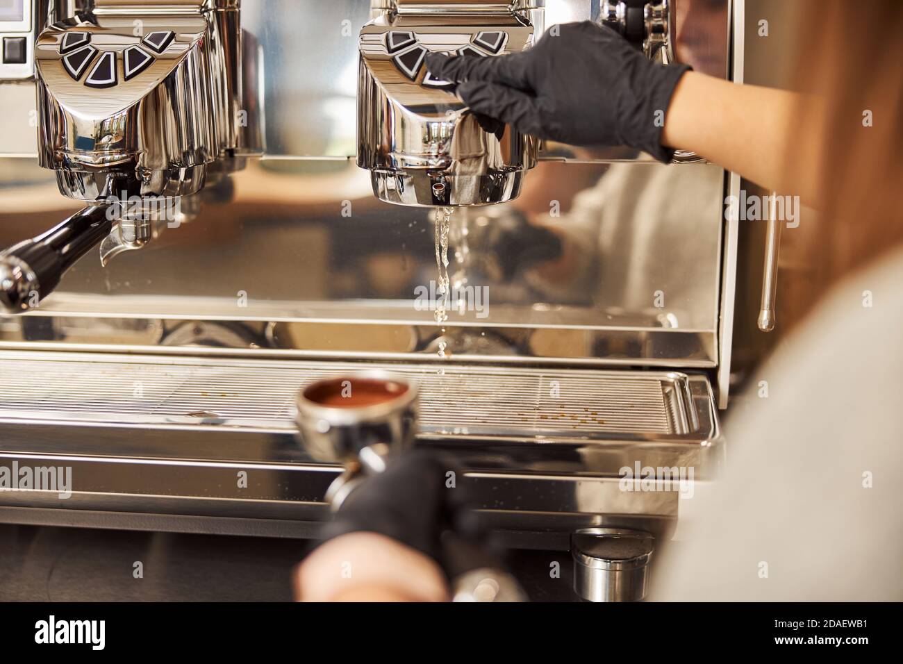 Cleaning the espresso machine before making new cup of coffee Stock