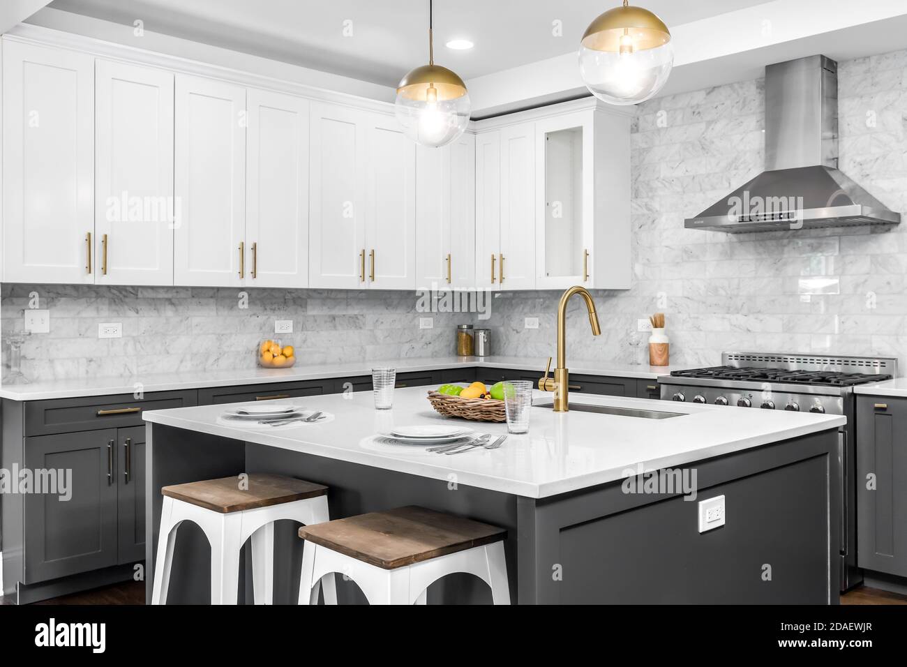 A luxurious white and grey kitchen with gold hardware, Bosch and ...