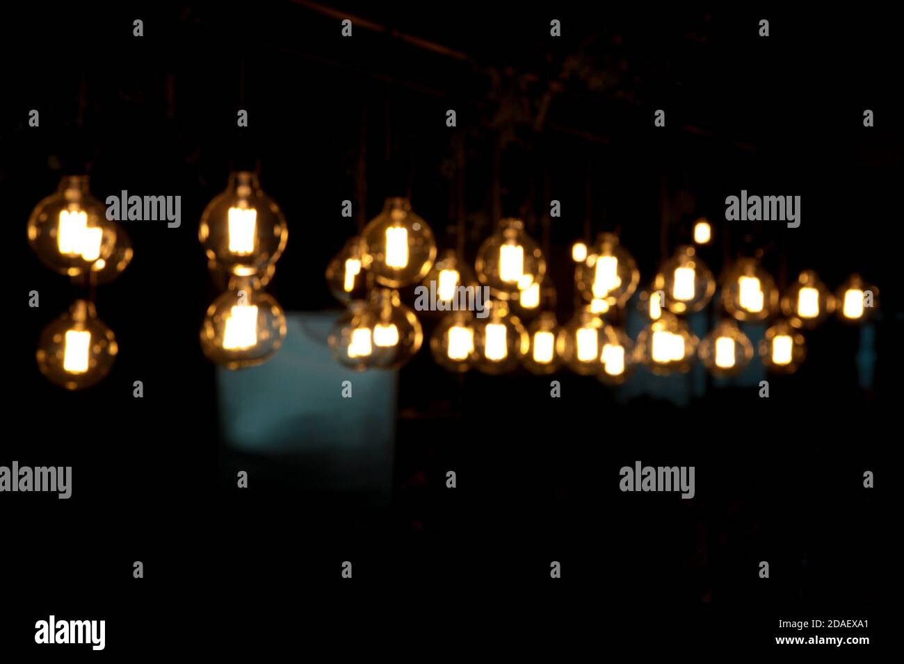 Lighting decor. Group of lamps in the dark. Blurred background Stock