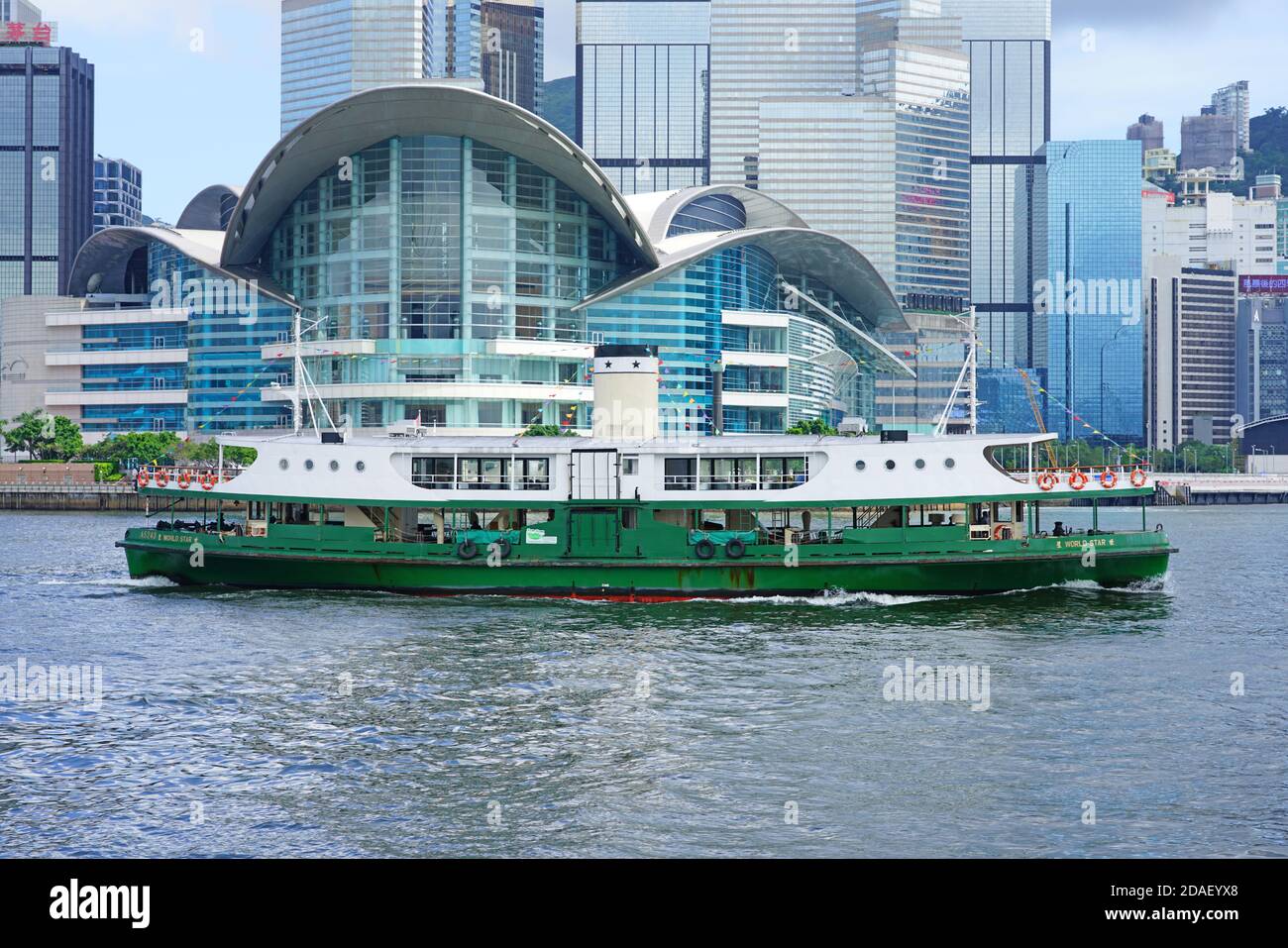 HONG KONG -29 JUN 2019- View of a Star Ferry ship in the Victoria Harbor in Hong Kong between Hong Kong and Kowloon in front of the Wan Chai conventio Stock Photo